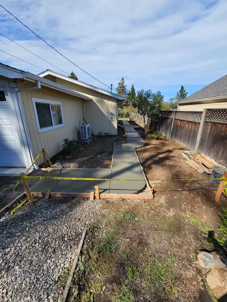 Curved concrete walkway at a house