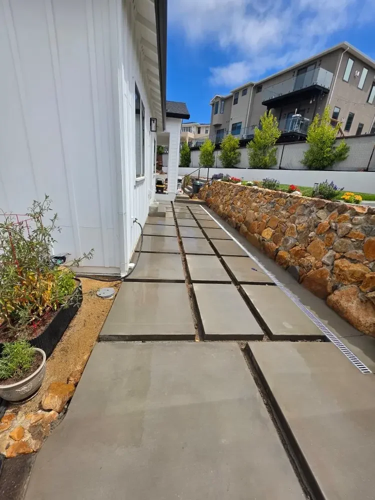 Rectangular concrete walking pads in a long row